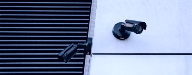 Modern surveillance cameras on an architectural facade